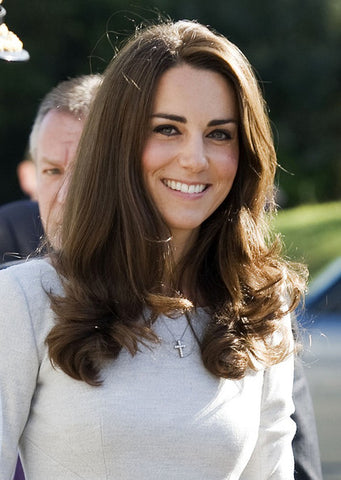 Catherine Duchess of Cambridge Kate Middleton wears cross pendant necklace