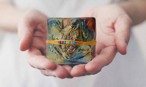 Woman holding innerSpirit Rattle