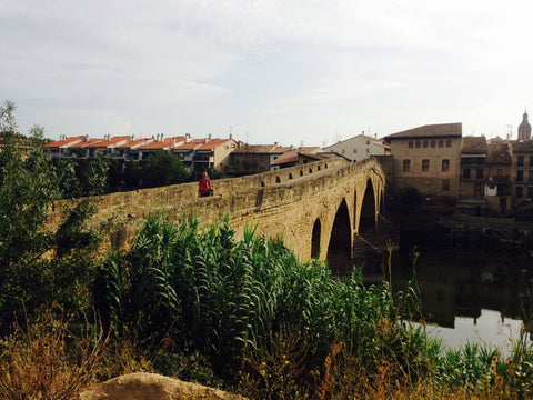 Crossing the Pilgrim's Bridge in Puenta la Reina