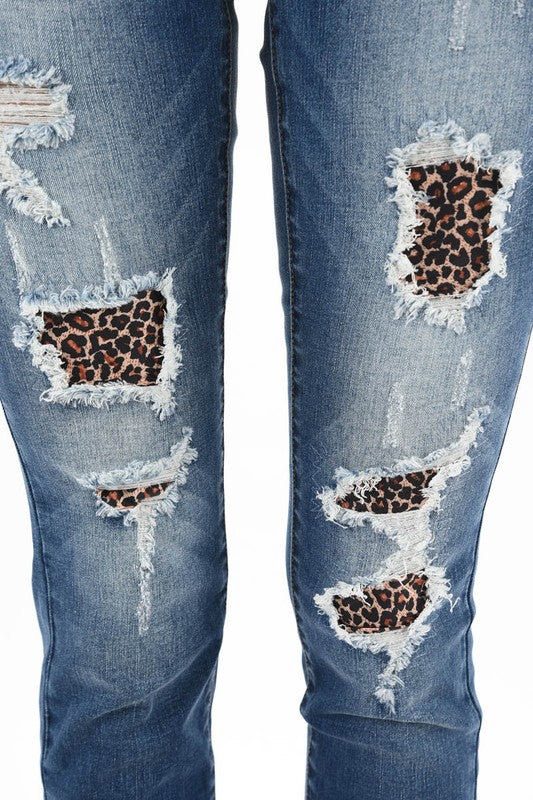 medium wash distressed skinny jeans with leopard print patch