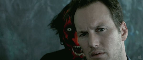 image of demon behind man in insidious movie