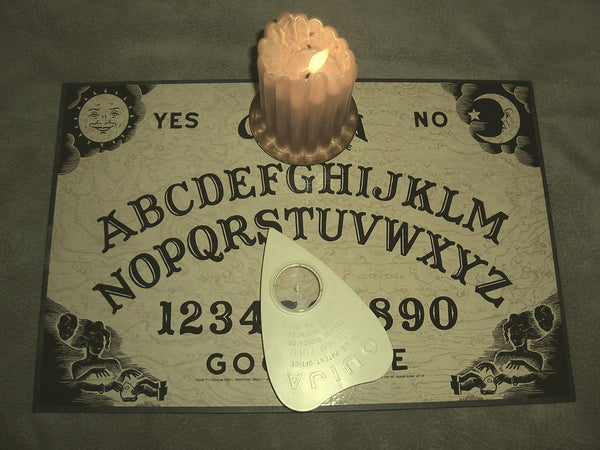 ouija board with candle