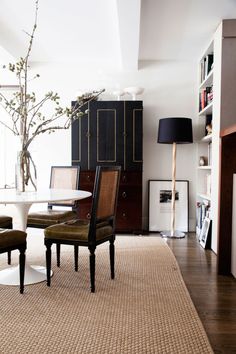 sharp black dining room with french chairs