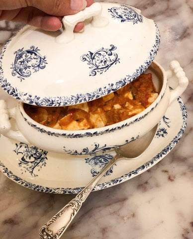 Indian curry in french tureen, white and blue porcelain. Luxury and comfortable life. 