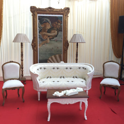 Luxurious French Louis XVI Bergere sofa with symmetric decor at French chateau gala event