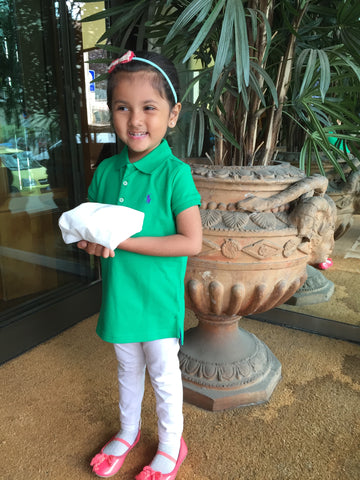 little pretty girl with a terra-cotta italian urn