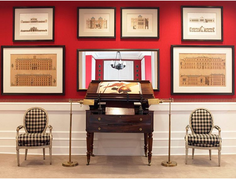 modern red room with small french louis XVI chairs