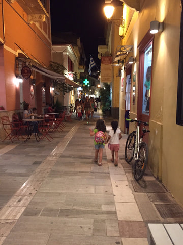 Two girls walking around in the streets of Nafplion in greece. Friendship, love, one world, Travel, vacation, family, travel with children, mediterranean travel