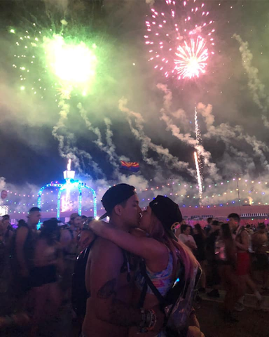 Ravers kissing under the fireworks at EDC