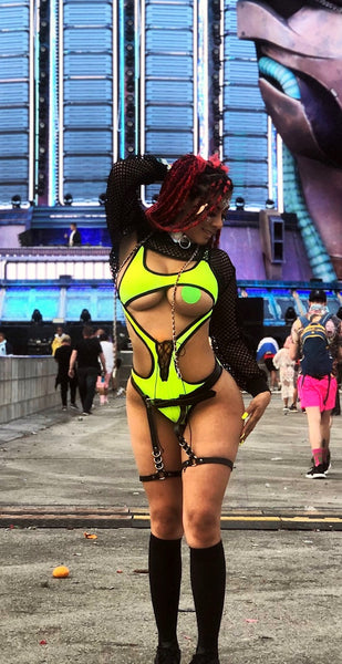 Mobster Kitten wearing strappy neon bodysuit and leg harness at EDC
