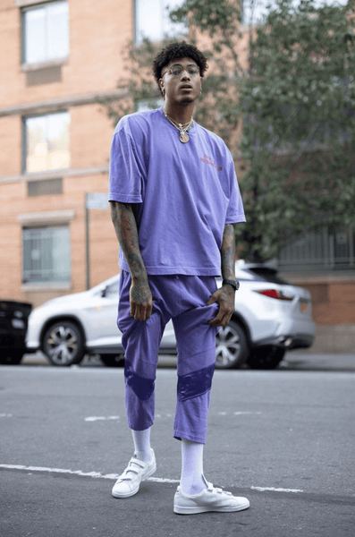 Kelly Oubre Jr. in a purple outfit
