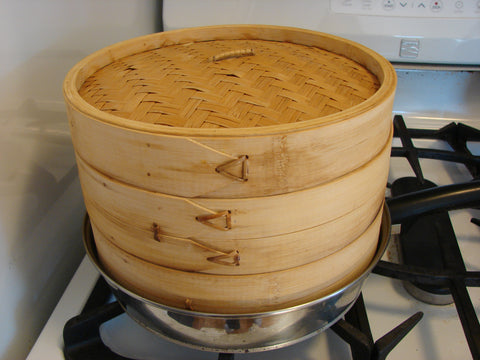 photo of a steamer basket on the stovetop