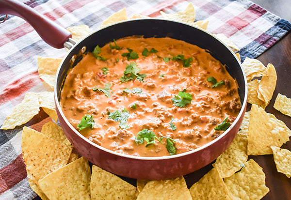beefy skillet queso in skillet with tortilla chips