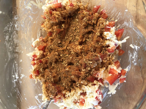 up close image of stuffing with seasoning in bowl