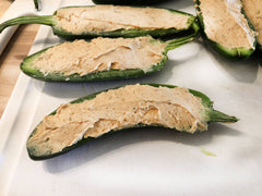 image of jalapenos stuffed with dip and dressing mix cream cheese