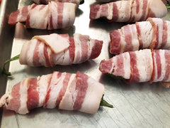 image of bacon wrapped around jalapeno popper