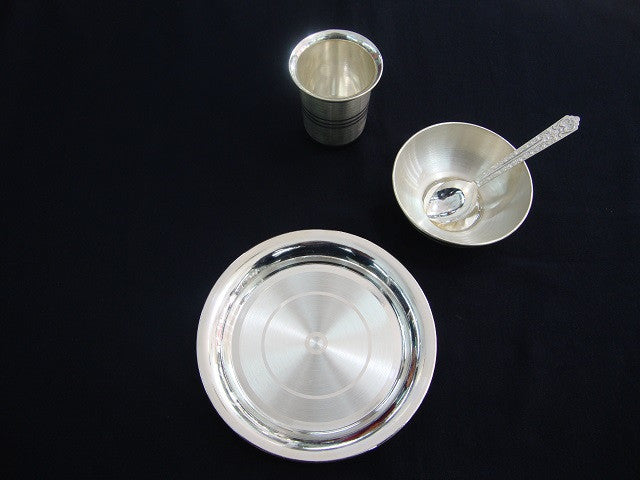 silver bowl and spoon for baby feeding
