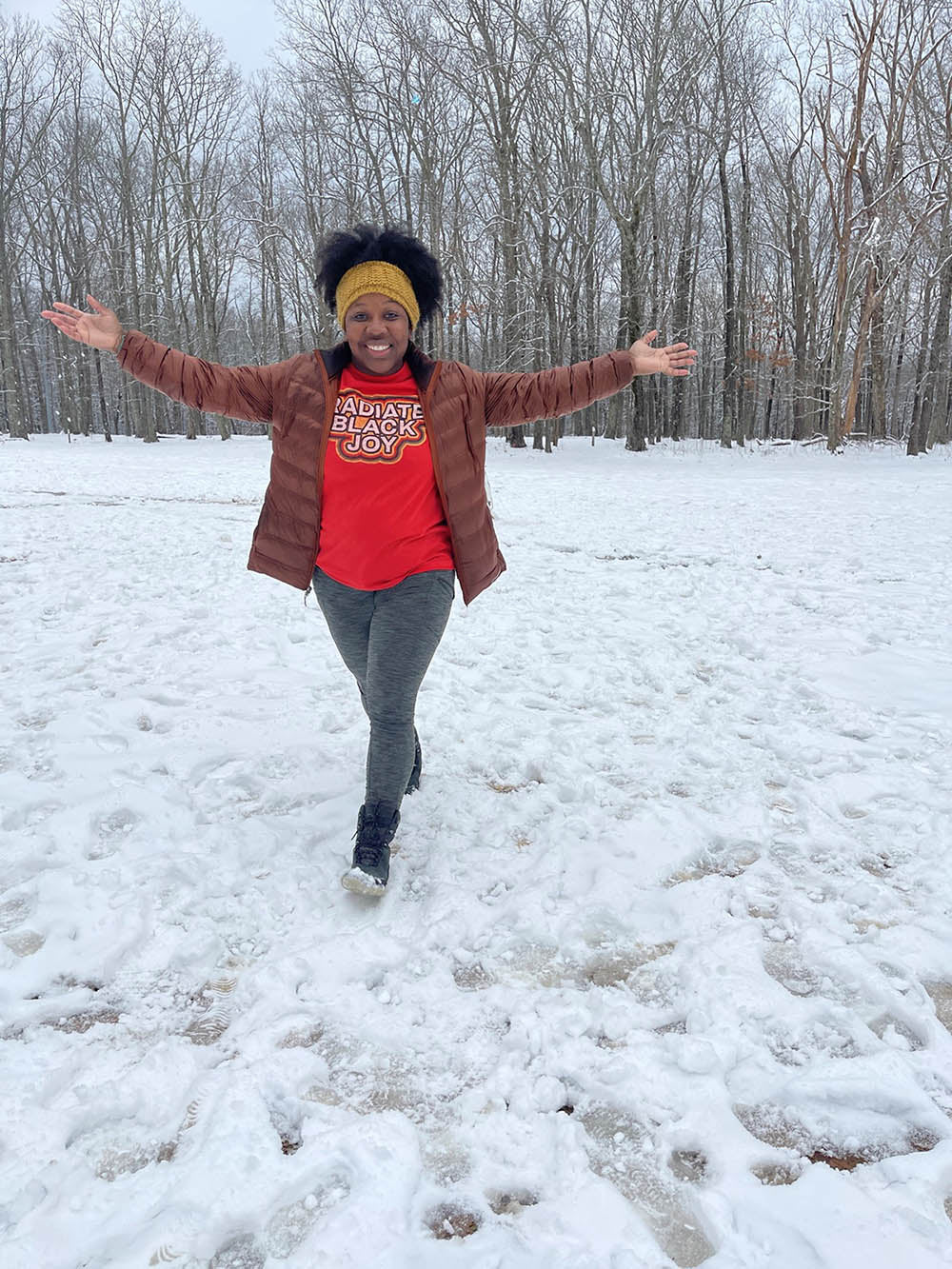 woman smiling in field with snow