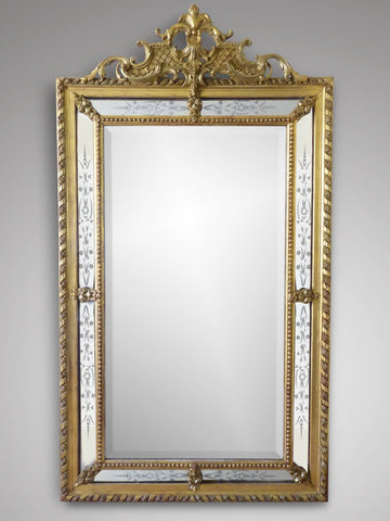 The large 19th century giltwood wall mirror is a brilliant statement piece. 