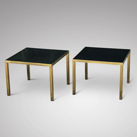 A stylish pair of retro brass side tables with rich black Formica tops