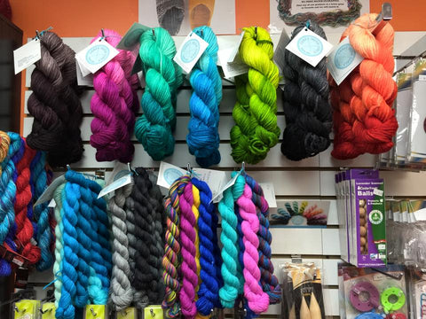 Three Irish Girls Yarns displayed on store wall