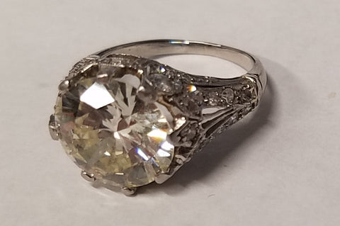 A bulky, traditional family heirloom wedding ring with a five-carat diamond, which was brought to us to be repurposed as a custom made wedding ring.