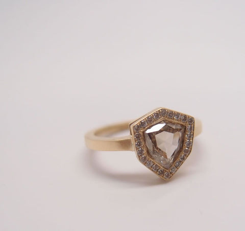 This one-of-a-kind Champagne Diamond Shield Ring from Marion Cage features a pave diamond halo, the kind of unique detail you can request when you custom make wedding rings.