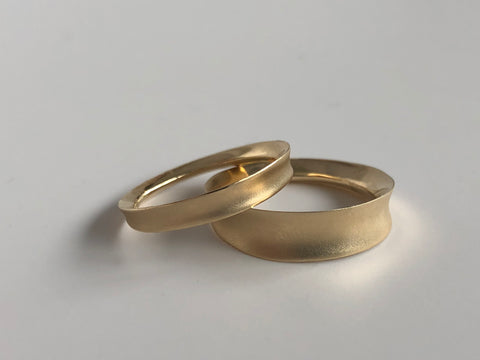 A set of matching gold wedding bands from Marion Cage.