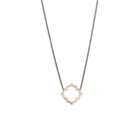 Mixed metal pieces, such as this Clover Necklace in 14k yellow gold on an oxidized chain from Marion Cage, are a great way to save money will still getting the benefits of real gold jewelry.