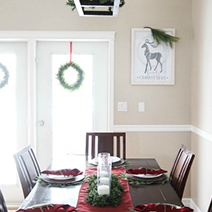 Family Christmas personalized print in a Christmas decorated farmhouse dining room