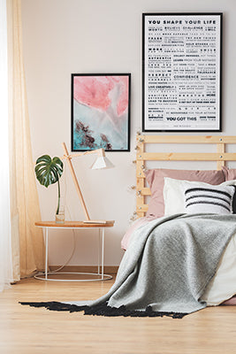 Modern bedroom with the Manifesto and Unlocal prints on the wall