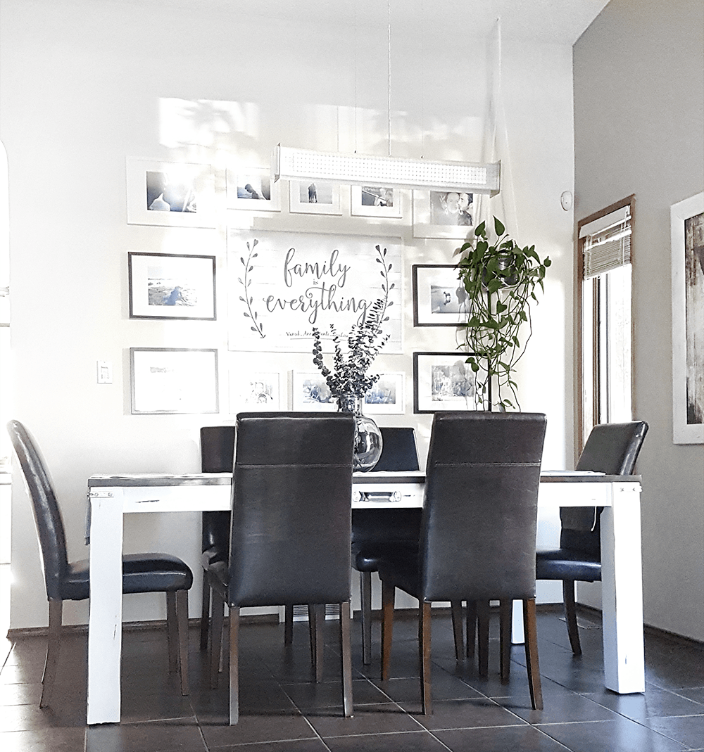 Farmhouse dining room with a beautiful gallery wall made up of family photos