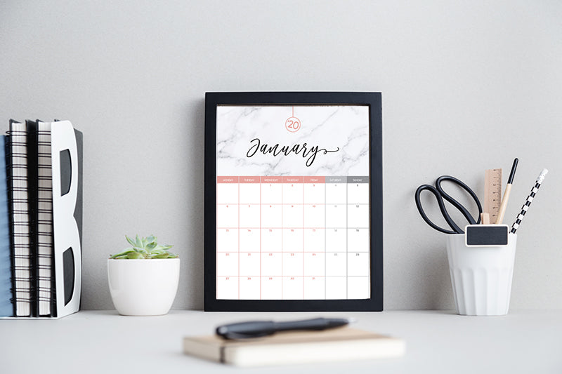 Modern black and white work space with a framed calendar printable