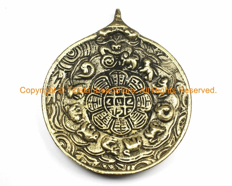 Round Tibetan Om pendant Tibetan calendar on reverse Large. Brass