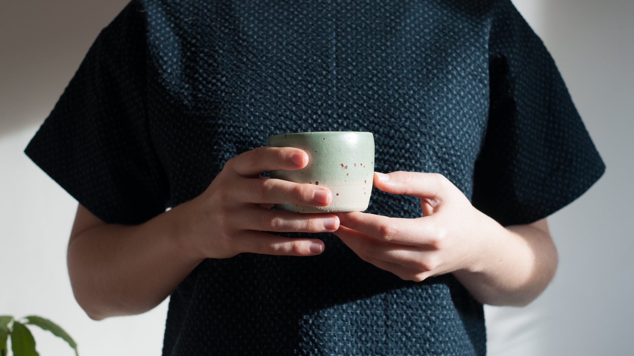 Viola holding a Celadon and Speckle Tea Bowl Dor and Tan