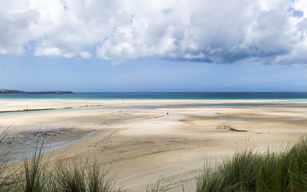 Shadows across Hayle beach, St Ives can be seen in the background
