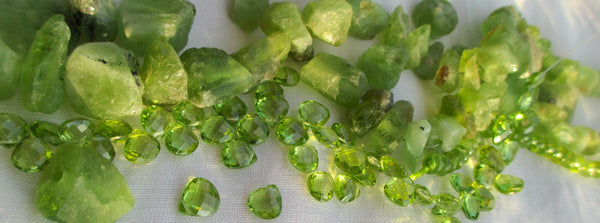 Raw and faceted peridot