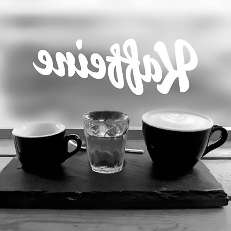 Kaffeine coffee cups by window - 11 of london's best coffee shops 