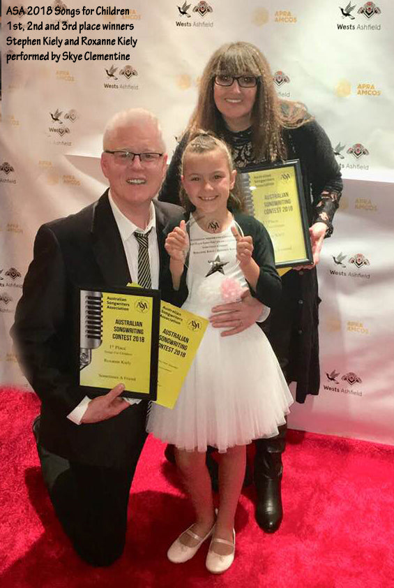 Stephen Kiely and Roxanne Kiely celebrate their 1st Place win in the Song for childrern category of the Australian Songwriters Association 2018 song competition awards. They are pictured here with Skye Clementine, who recorded the song and sang it live at the awards show.