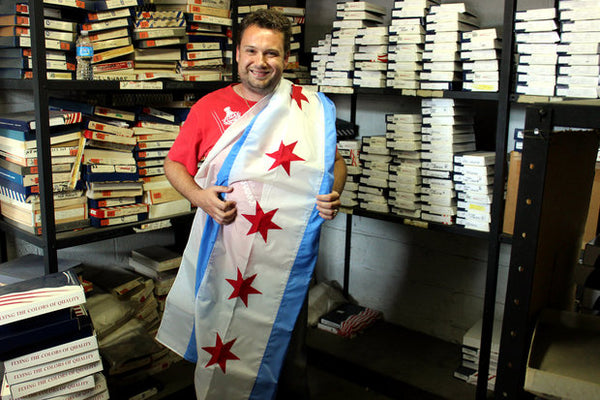 Image of man holding a rare Chicago Flag with 5 stars