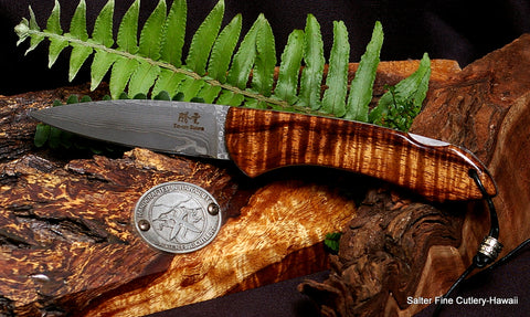 3.5 inch folding pocket knife featuring titanium liners, hand-forged Japanese VG10 damascus blade and beautiful curly koa wood handle