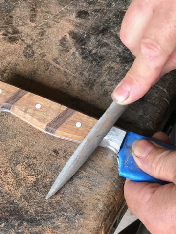Handshaping a metal bolster for a chef knife set by Salter Fine Cutlery