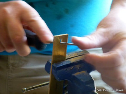 Lots of handwork. Here making what will be a brass bolster on a decorative handle.