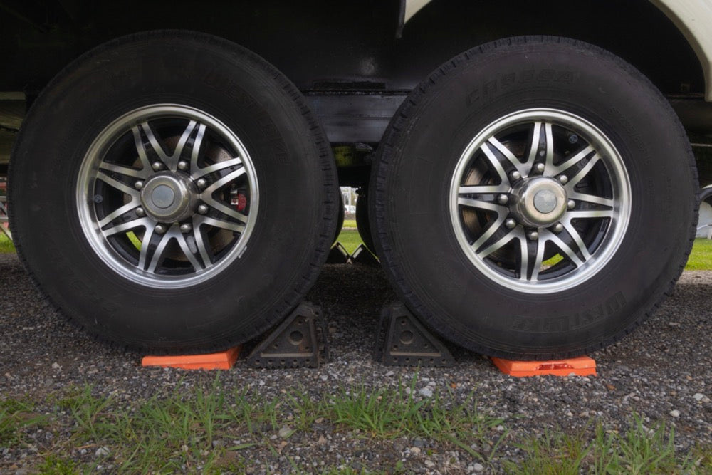 Wheel chocks and blocks on fifth wheel while leveling.