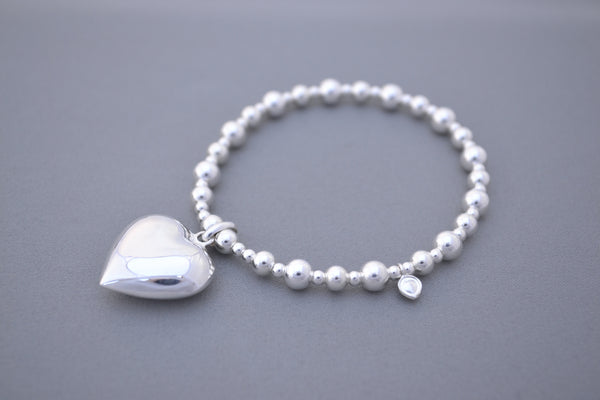 silver bead bracelet with heart charm