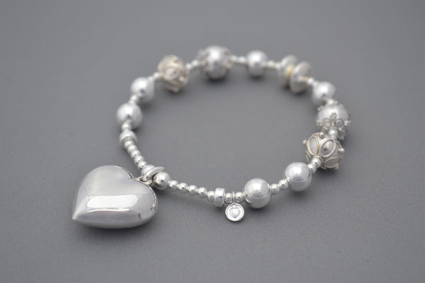 silver bead bracelet with heart charm