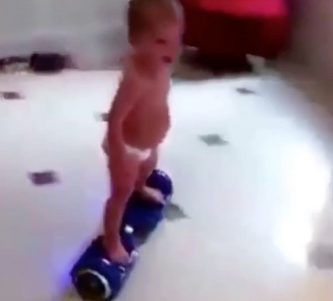 baby rides hoverboard