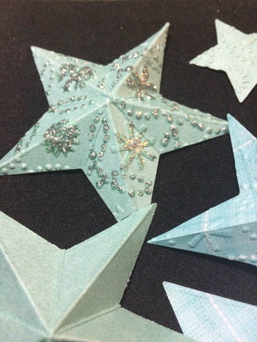 handmade 3D stars embossed and glittered for a Christmas wreath