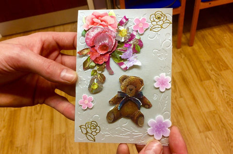 beginner's handmade card using embossing and decoupage during group activities with donated supplies