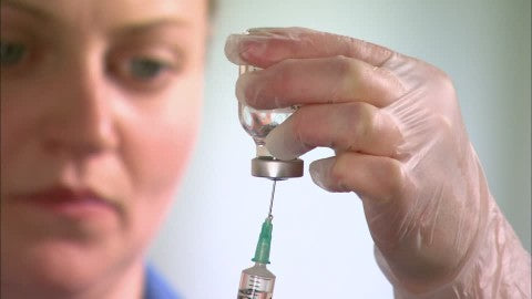 nurse drawing medication from bacteriostatic water vial